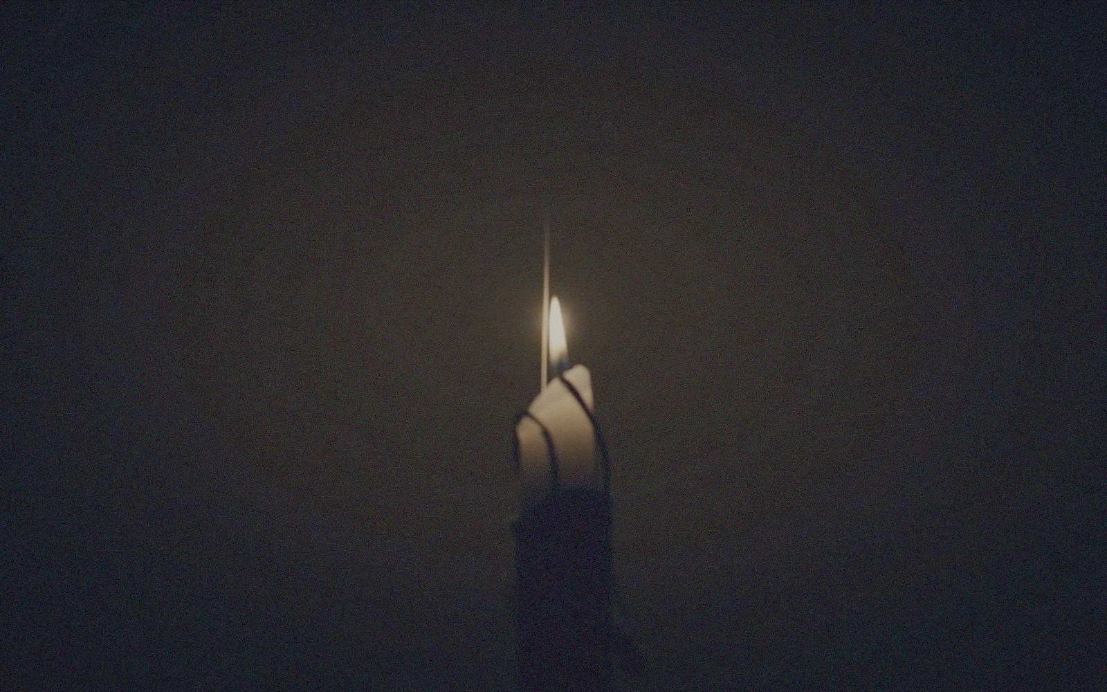 Candlelit still life evoking the film's wire work